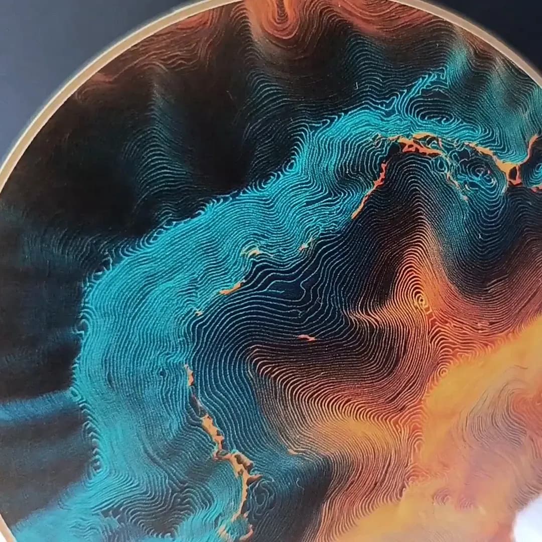 Topographic coaster held in white cotton gloves, showing the fine contour lines of the print