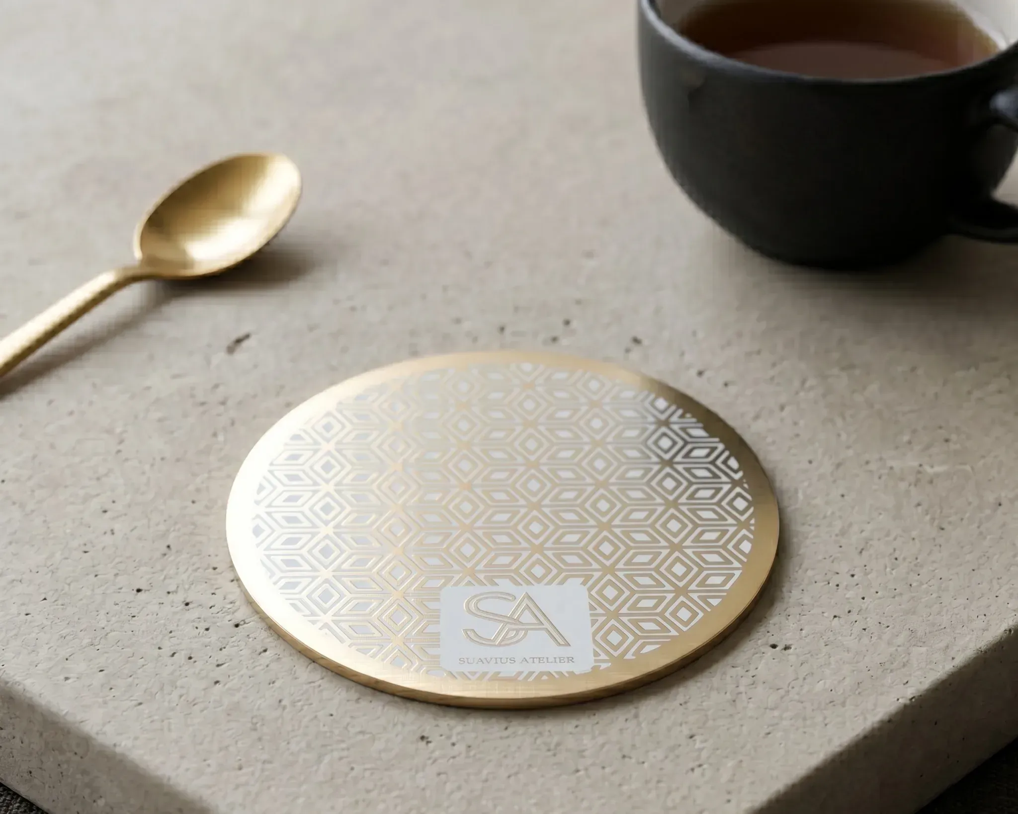 tennis court PCB coaster styled on a desk beside a cup